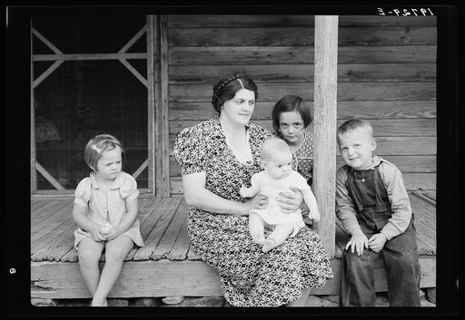 Wife and children of tobacco sharecropper on front porch. Person County, North Carolina