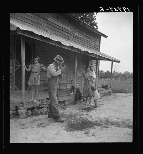 Tobacco sharecropper ready to return to the field. Person County, North Carolina