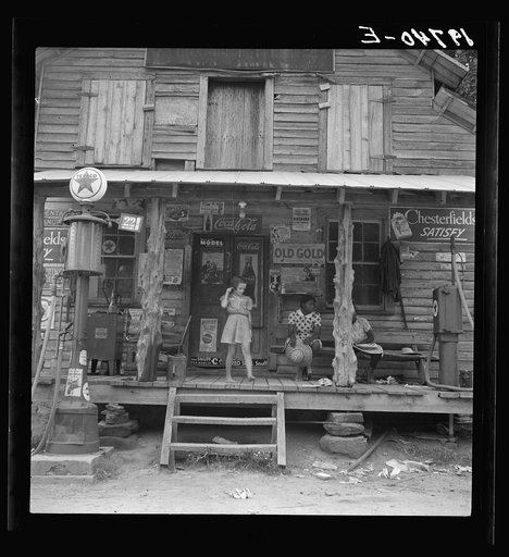 Daughter of white tobacco sharecropper at country store. Person County, North Carolina