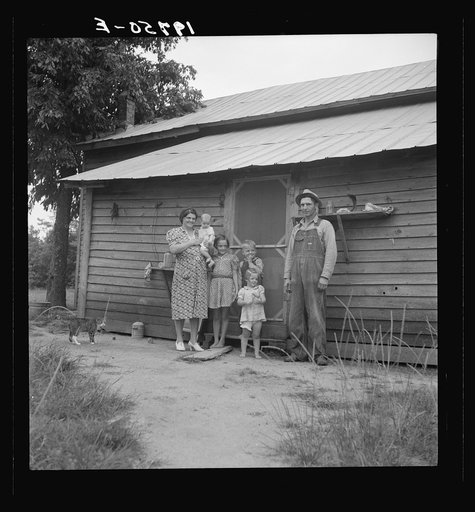 Untitled photo, possibly related to: Tobacco sharecropper with his oldest daughter. Person County, North Carolina