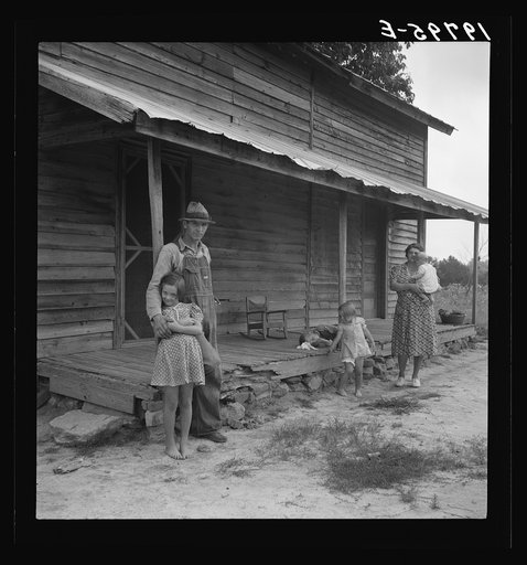 Untitled photo, possibly related to: Tobacco sharecropper with his oldest daughter. Person County, North Carolina