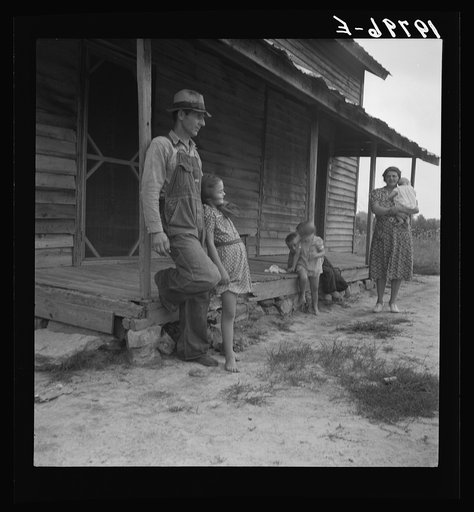 Untitled photo, possibly related to: Tobacco sharecropper with his oldest daughter. Person County, North Carolina