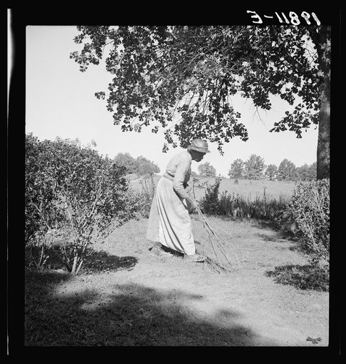 Caroline Atwater, wife of Negro owner, has a well-swept yard