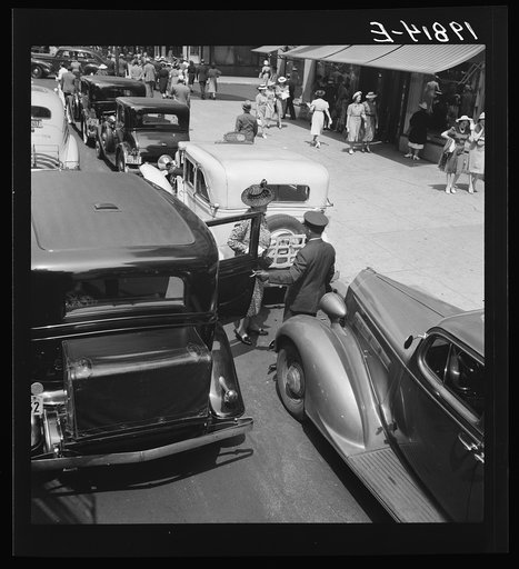 Fifth Avenue approaching 57th Street. New York City. Some New Yorkers use personally owned limousines driven by private uniformed drivers.  New York City, New York