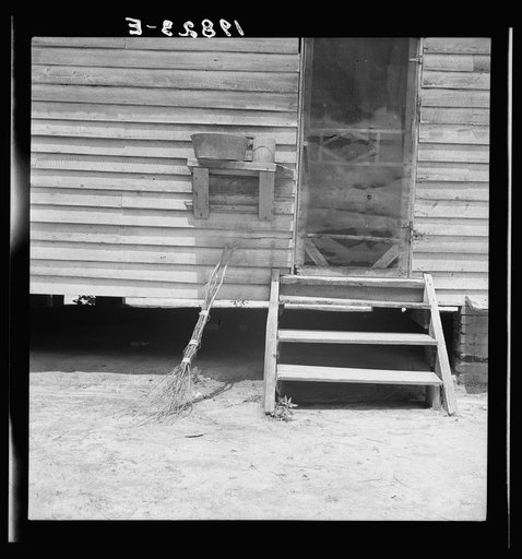 Kitchen door of Zollie Lyon's house. Note brushbroom. Wake County, North Carolina