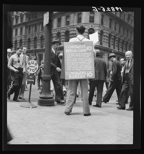 Untitled photo, possibly related to: 42nd Street and Madison Avenue. Street hawker selling Consumer's Bureau Guide. New York City