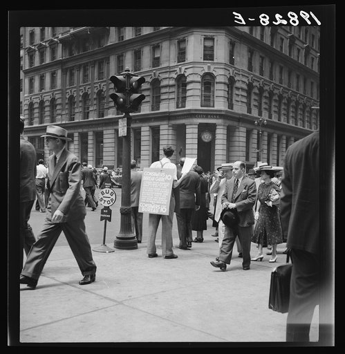 Untitled photo, possibly related to: 42nd Street and Madison Avenue. Street hawker selling Consumer's Bureau Guide. New York City