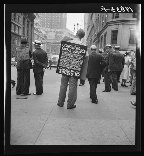 Untitled photo, possibly related to: 42nd Street and Madison Avenue. Street hawker selling Consumer's Bureau Guide. New York City