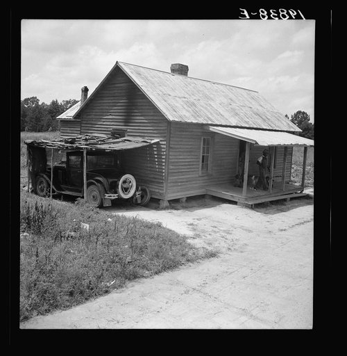 Home of Negro tobacco tenant with addition of improvised garage. Wake County, North Carolina
