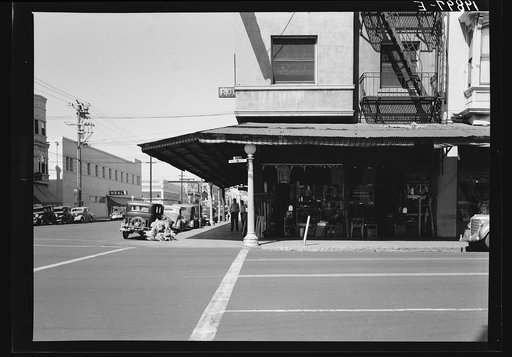 Untitled photo, possibly related to: Fresno. Street corner of San Joaquin Valley town on U.S. 99 showing secondhand store. California