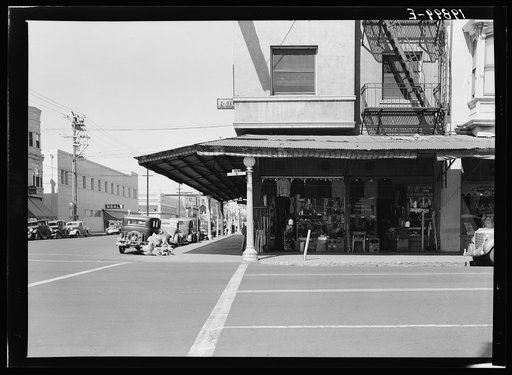 Untitled photo, possibly related to: Fresno. Street corner of San Joaquin Valley town on U.S. 99 showing secondhand store. California