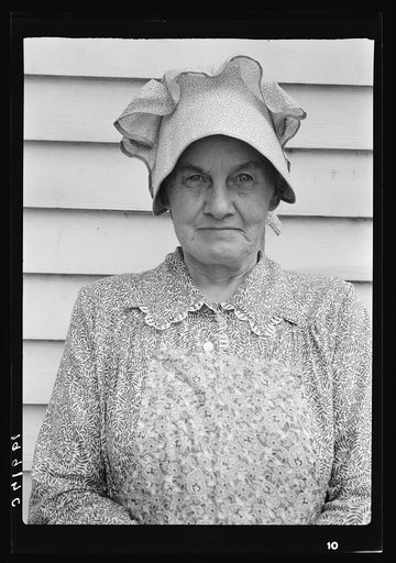 Member of the congregation of Wheeley's church who is called "Queen." She is wearing the old fashioned type of sunbonnet. Her dress and apron were made at home. Near Gordonton, North Carolina