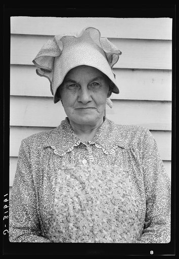 Untitled photo, possibly related to: Member of the congregation of Wheeley's church who is called "Queen." She is wearing the old fashioned type of sunbonnet. Her dress and apron were made at home. Near Gordonton, North Carolina