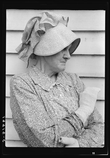 Native of North Carolina. Sunbonnet, and homemade old-fashioned knit gloves. This woman is a member of Wheeley Church congregation. Near Gordonton, North Carolina