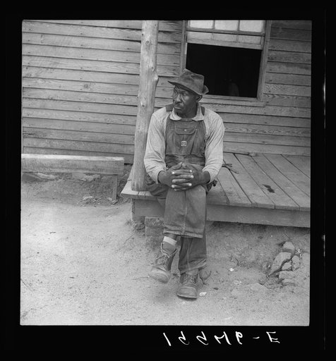 Father of sharecropper family. He is sixty-nine years old, has six acres of tobacco, has a large family. Heard in conversation on his porch, "Land is like folks. It gets tired and needs a rest." Person County, North Carolina