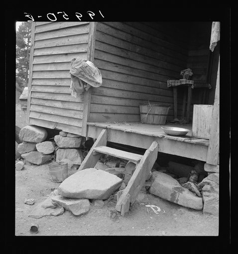 Porch leading to kitchen of sharecropper cabin. They have been putting up strawberries. The sack which hangs on the side wall was used as a strainer  Person County, North Carolina