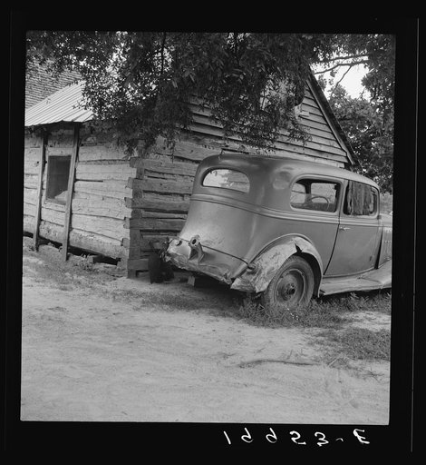 Car belonging to Negro share tenant family. The mother said they were not running it because they did not have the money to buy tags. "I always say rations and clothes comes before riding. I can stay at home." Near Gordonton, North Carolina