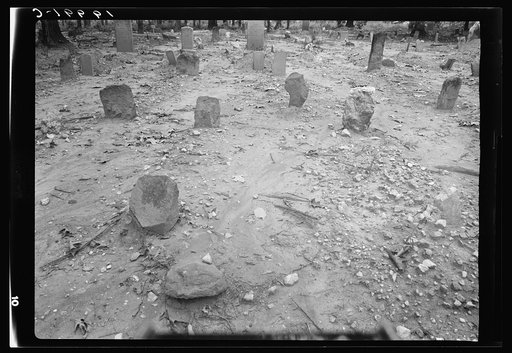 A red clay Negro cemetery. No attempts to lay out crops. The graves in rows with narrow spaces between. This cemetery was a solid space of red clay washed by the rains. Even the gravestones are colored red by the red clay beaten against them by rain. On such markers as are cut there was misspelling 