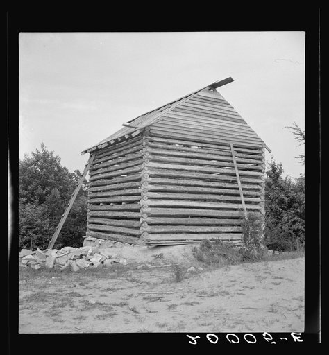 Log cabin barn under construction. "Four room" barn near ready for chinking. Negro tenants living nearby say it takes about two weeks to build such a barn. No work was being done on barn when photograph was taken as it was the Fourth of July. Near Concord, Person County, North Carolina