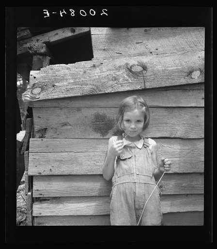 Untitled photo, possibly related to: Eight year old daughter who helps about the tobacco barn and takes care of the baby. Granville County, North Carolina