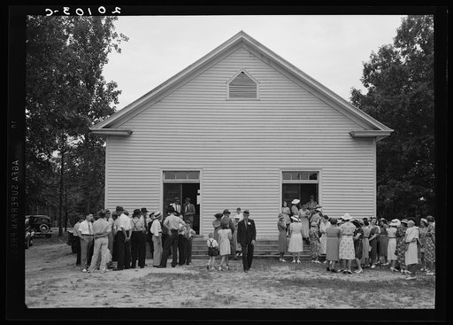 Untitled photo, possibly related to: Congregation gathers in groups to talk after services are over. Wheeley's Church, Person County, North Carolina