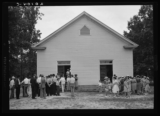 Untitled photo, possibly related to: Congregation gathers in groups to talk after services are over. Wheeley's Church, Person County, North Carolina