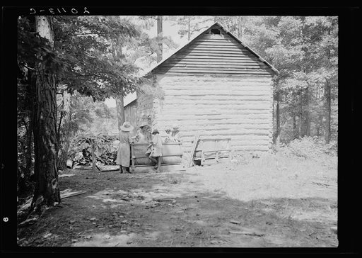 Untitled photo, possibly related to: Families stringing tobacco brought in from the field by sled. Granville County, North Carolina