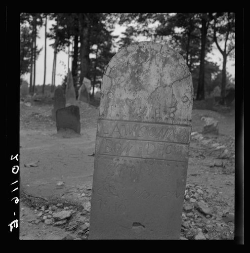 Tombstone in a red clay Negro cemetery. Person County, North Carolina
