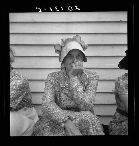 Untitled photo, possibly related to: Member of the congregation of Wheeley's church who is called "Queen." She is wearing the old fashioned type of sunbonnet. Her dress and apron were made at home. Near Gordonton, North Carolina