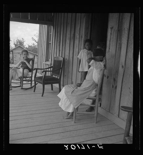 Untitled photo, possibly related to: Wife of tenant farmer with two of her six children, none of whom go to school. Chatham County, North Carolina