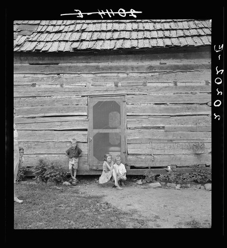 Log home of rural non-farm family. Father works in a chair making factory. Orange County, North Carolina