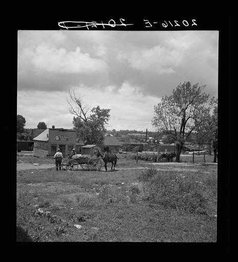 Siler City, North Carolina. Wagons pulled up in field one block away from the main street