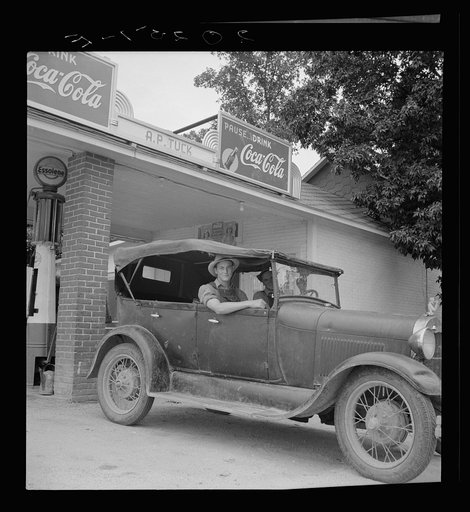 Untitled photo, possibly related to: Young North Carolinian in old Ford. He does not farm. "Works for wages." At Tuck's filling station. Person County, North Carolina
