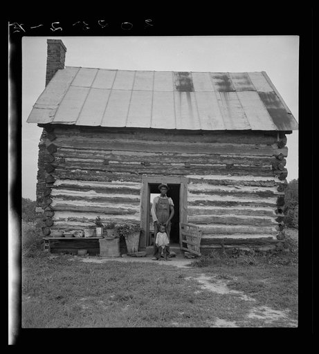 Untitled photo, possibly related to: Young sharecropper and his first child. Hillside Farm. Person County, North Carolina