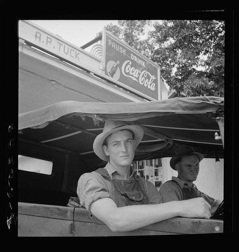 Young North Carolinian in old Ford. He does not farm. "Works for wages." At Tuck's filling station. Person County, North Carolina