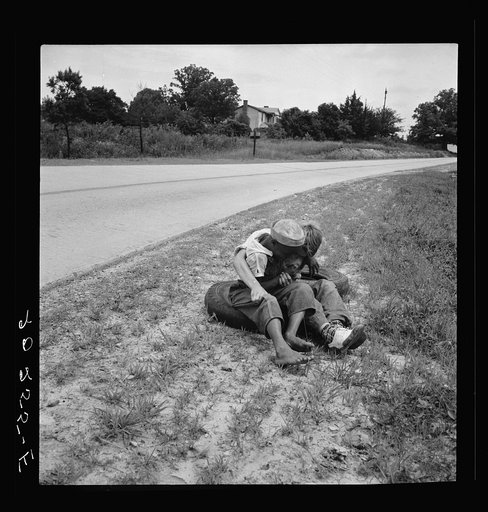 Untitled photo, possibly related to: White and Negro boy wrestling by side of road. Person County, North Carolina
