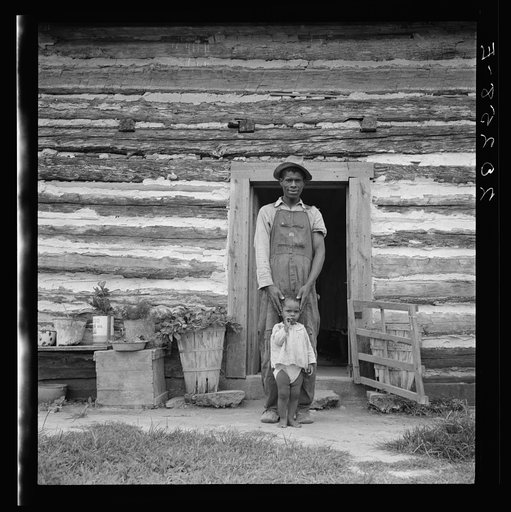 Young sharecropper and his first child. Hillside Farm. Person County, North Carolina