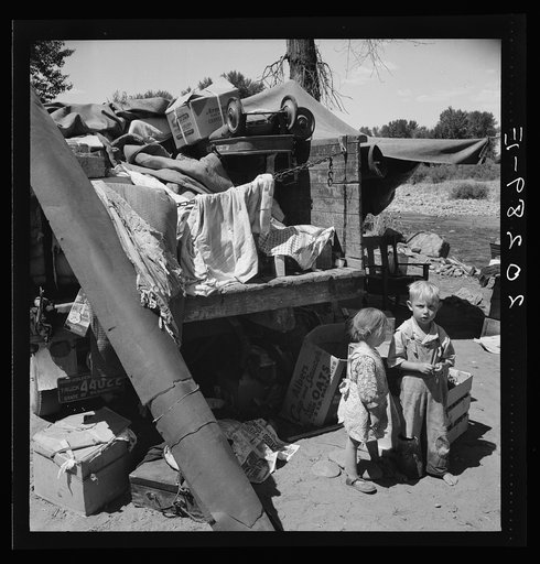 Untitled photo, possibly related to: Migratory children living in "Rambler's Park." They have lived on the road for three years. Nine children in the family. Yakima Valley, Washington