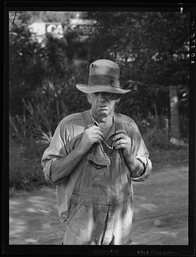 Migratory worker in auto camp. Single man, speaks his mind. "Them WPAs are keeping us from a living. They oughtn't to do it. It ain't fair in no way. The government lays them off (that is in Work Projects Administration - 1939) and they come in because they're locals and take the jobs away from us t