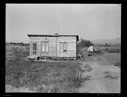 Untitled photo, possibly related to: Washington, Yakima. Homes are built bit by bit with whatever materials are available. Many drought refugees settle in Sumac Park, one of several large shacktowns around Yakima