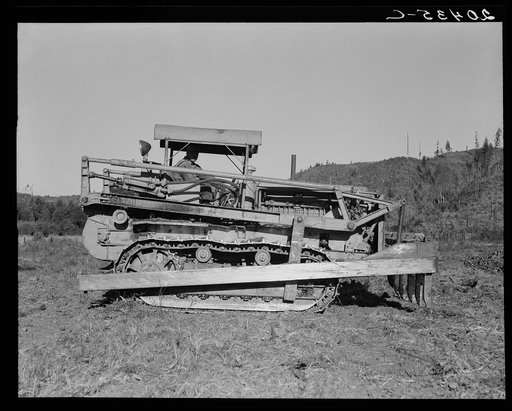 Western Washington, Lewis County. Caterpillar clearing land on cut-over western Washington farm