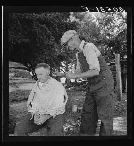 Oregon, Marion County, near West Stayton. Bean pickers barber each other. See general caption number 46
