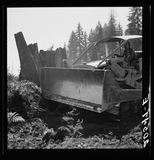 Untitled photo, possibly related to: Western Washington, Lewis County, near Vader. Bulldozer equipped with grader type blade. Nieman farm. General caption number 41