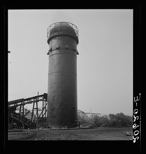 Pelican Bay Lumber Company. The burner is characteristic of the Northwest landscape as grain elevator is to the Plains. There are many types of variations. It is an essential part of the sawmill. Disposes of sawdust and waste. Near Klamath Falls, Klamath County, Oregon
