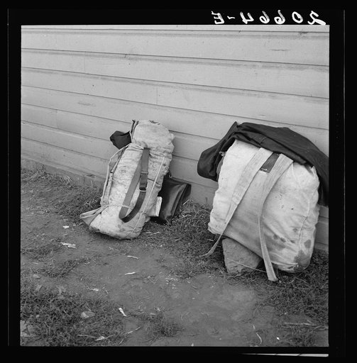 Bindles on shady side of Pastime Cafe. California, Siskiyou County, Tulelake