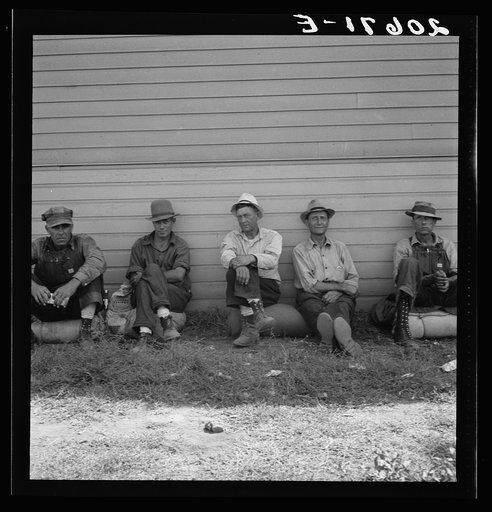 Untitled photo, possibly related to: Idle men seated in shade on the other side of Pastime Cafe, three weeks before opening of Klamath Basin potato harvest. California, Siskiyou County, Tulelake. See general caption number 43