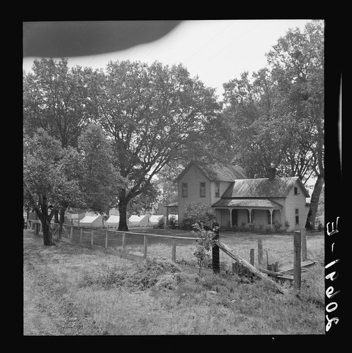 Untitled photo, possibly related to: Hop grower's home on Rogue River, with the tent camp he provides for his pickers beyond. Oregon, Josephine County, near Grants Pass. See general caption number 45-11