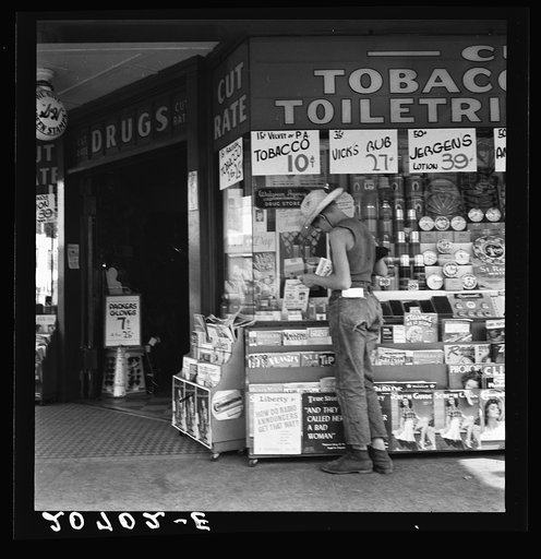 Untitled photo, possibly related to: Oregon. Medford. Half-grown farm boy on main drugstore corner in town