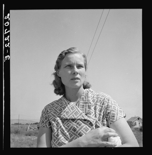 Oregon, Klamath County, Merrill. Young woman from a South Dakota farm, where her family still lives. She and her husband are migratory laborers and live in a shack in Klamath County waiting for potato harvest to open. "My husband just day labors."
