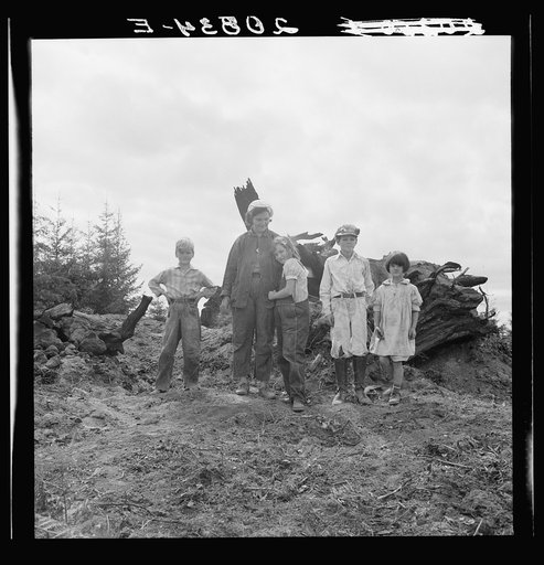Mrs. Arnold and her children before the stump pile. Western Washington, Thurston County, Michigan Hill. See general caption 36
